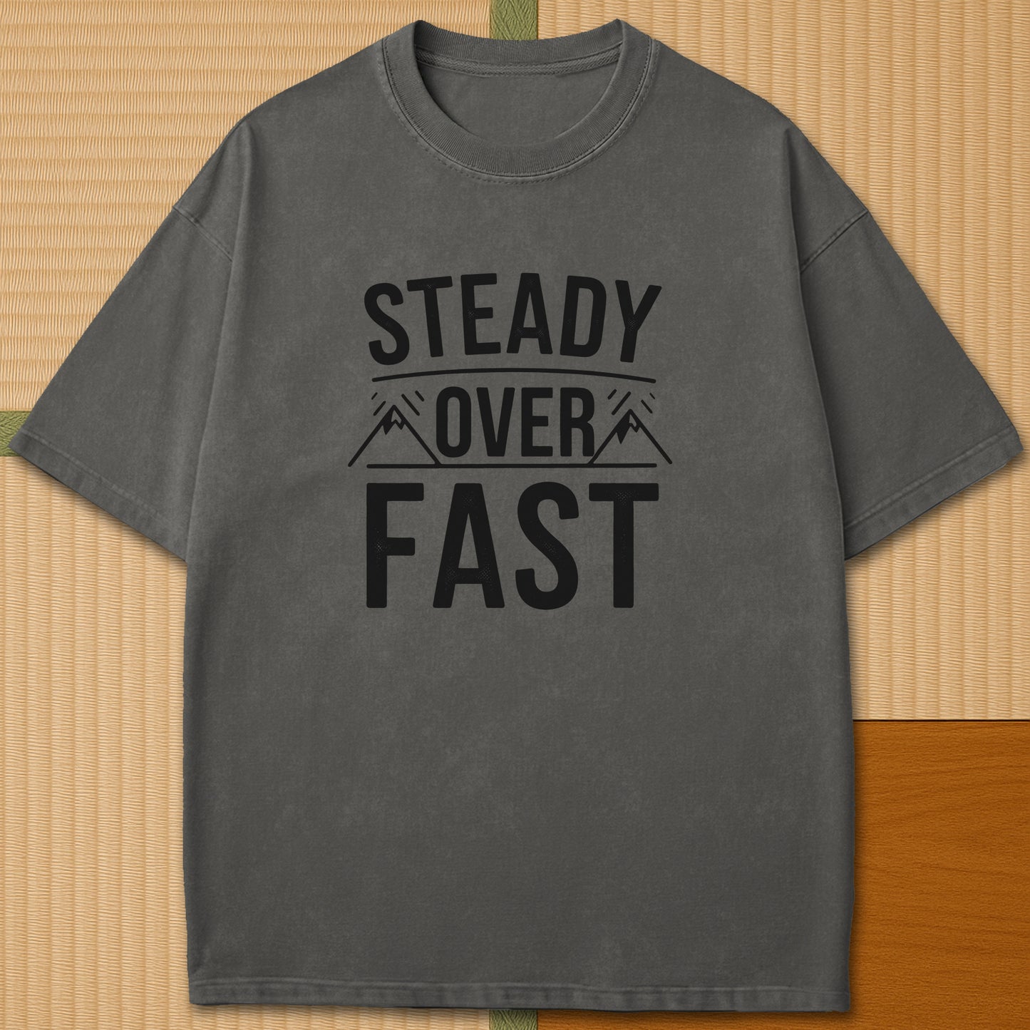 Japanese-inspired cotton Steady Over Fast T-Shirt in Pepper on Comfort Colors 1717, styled in a modern flatlay scene.