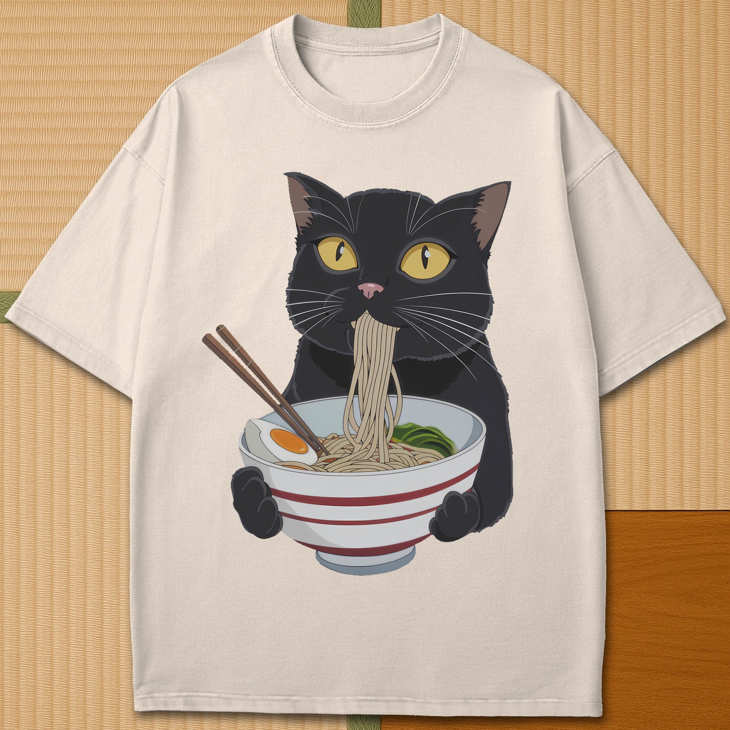 Japanese-inspired cotton Cat Eats Ramen T-Shirt in Ivory on Comfort Colors 1717, styled in a modern flatlay scene.