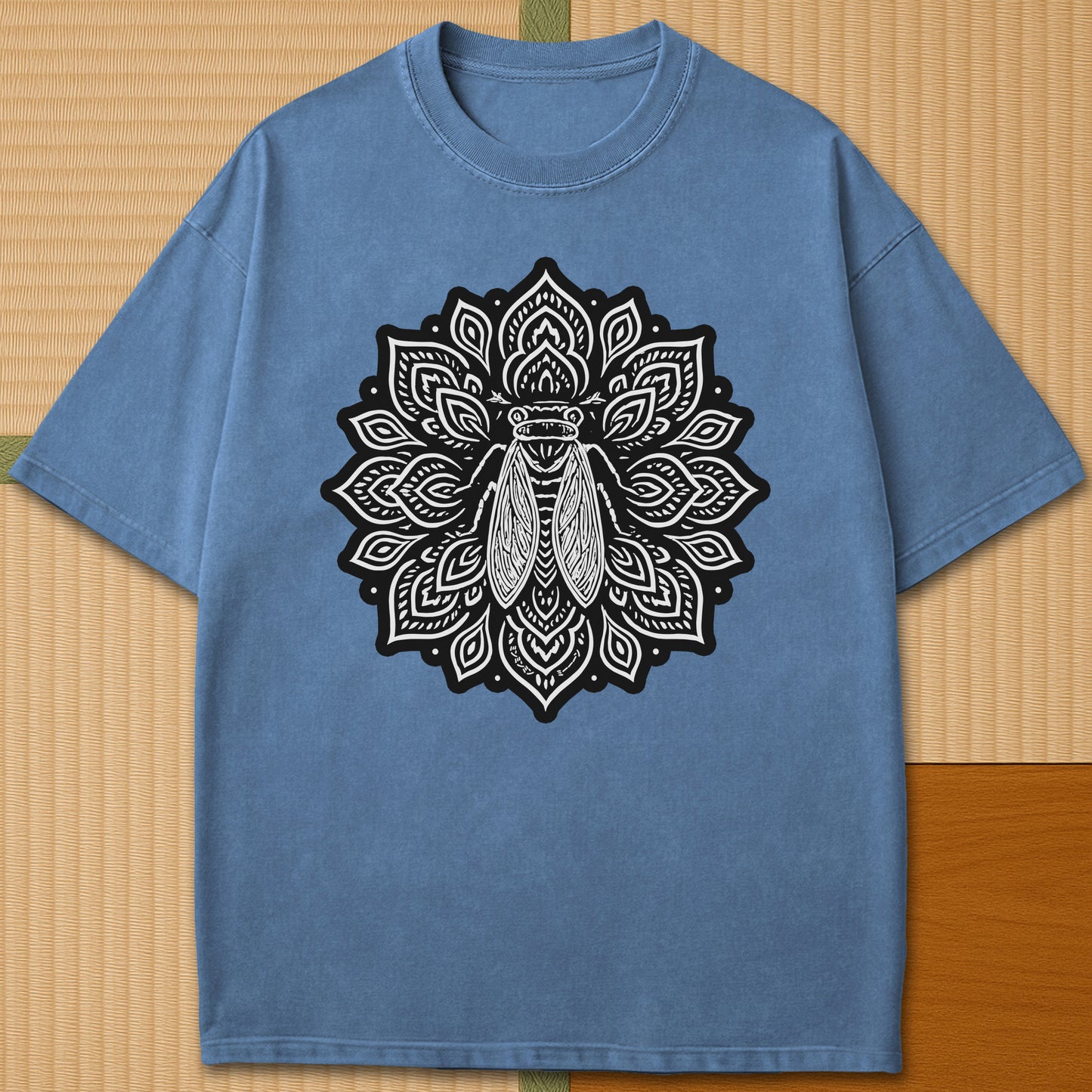 Japanese-inspired cotton Cicada Mandala T-Shirt in Blue Jean on Comfort Colors 1717, styled in a modern flatlay scene.