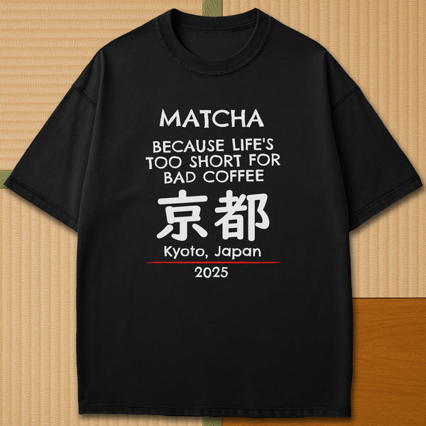 Japanese-inspired cotton Matcha Tokyo T-Shirt in Black on Comfort Colors 1717, styled in a modern flatlay scene.