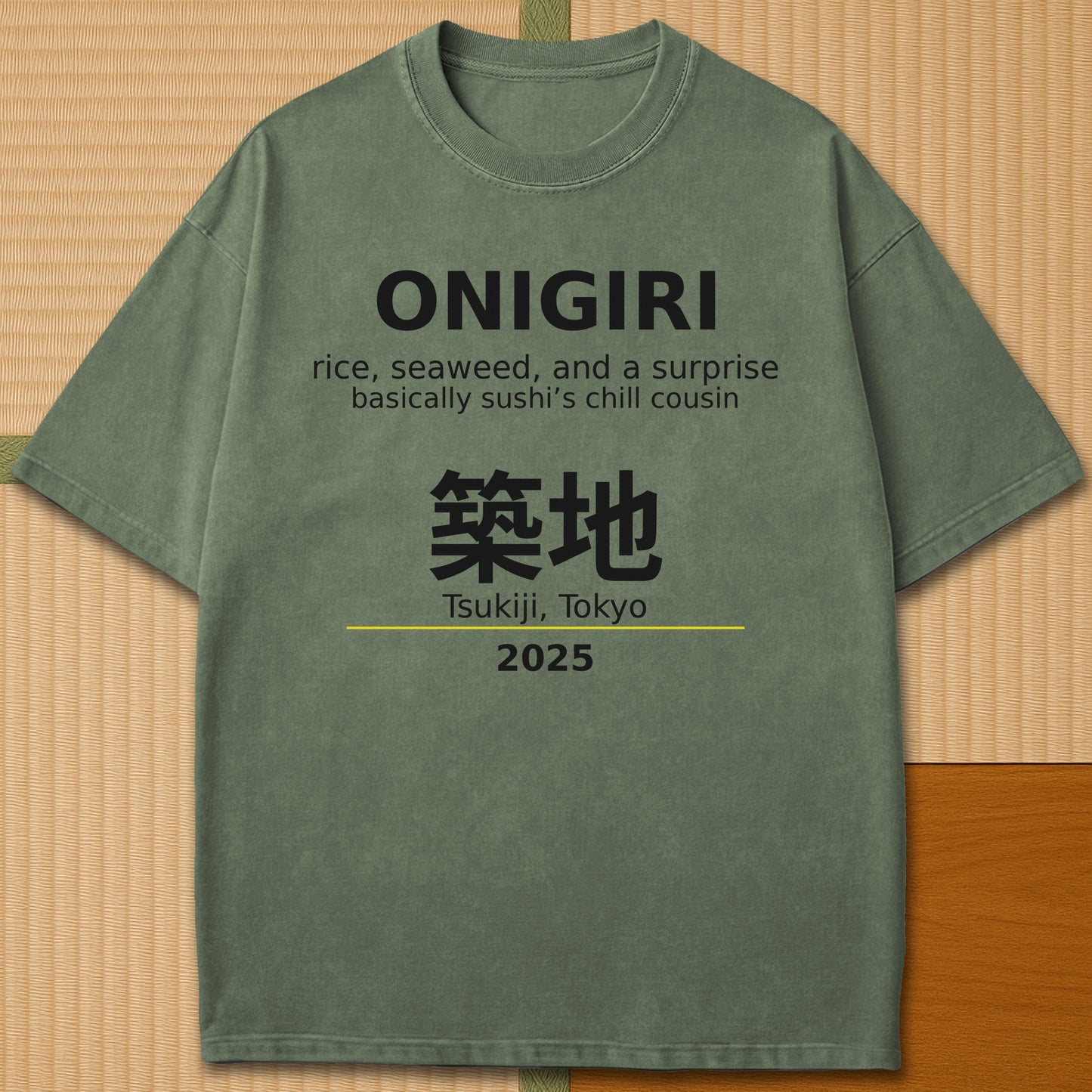 Japanese-inspired cotton Onigiri Tsukiji T-Shirt in Moss on Comfort Colors 1717, styled in a modern flatlay scene.