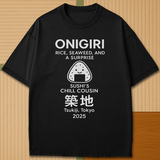 Japanese-inspired cotton Onigiri Chill Cousin Of Sushi T-Shirt in Black on Comfort Colors 1717, styled in a modern flatlay scene.