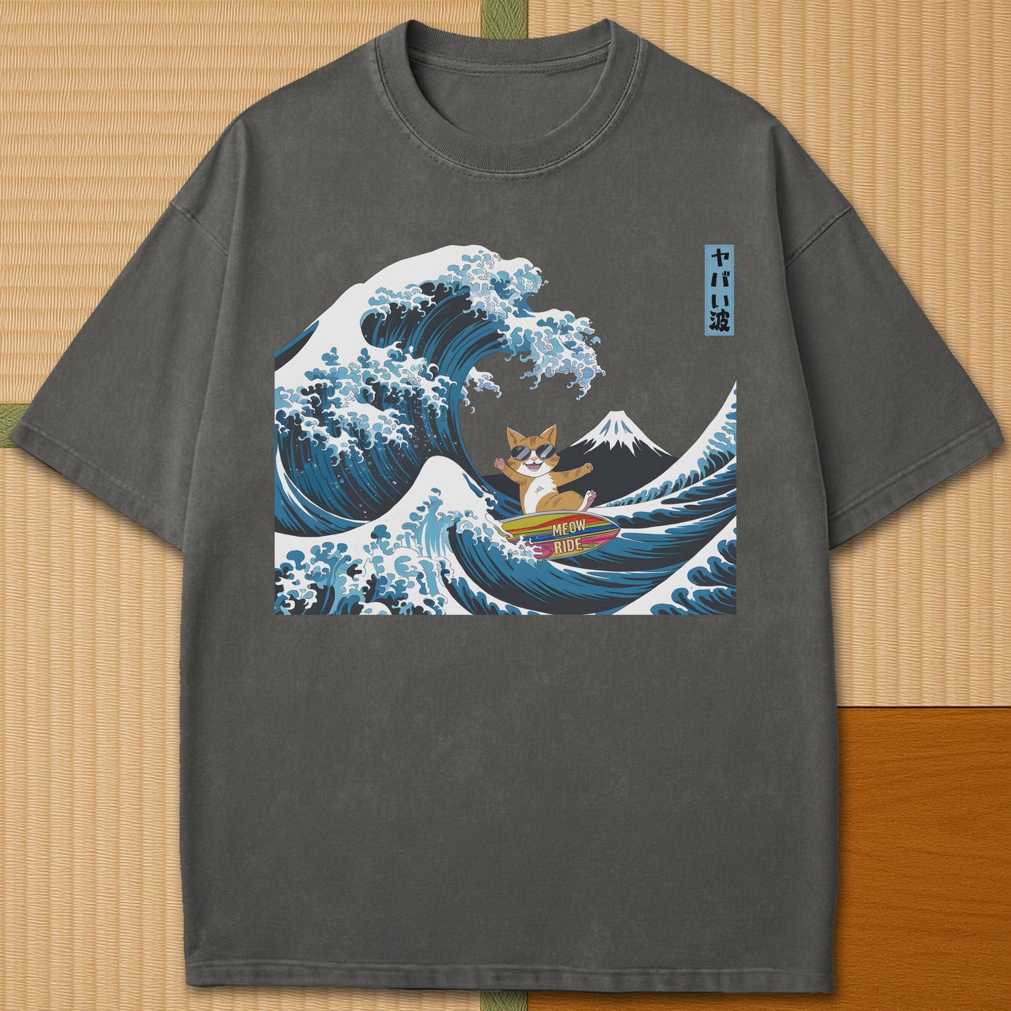 Japanese-inspired cotton Meow Ride T-Shirt in Pepper on Comfort Colors 1717, styled in a modern flatlay scene.