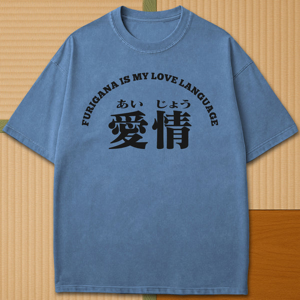 Japanese-inspired cotton Furigana Love Language T-Shirt in Blue Jean on Comfort Colors 1717, styled in a modern flatlay scene.