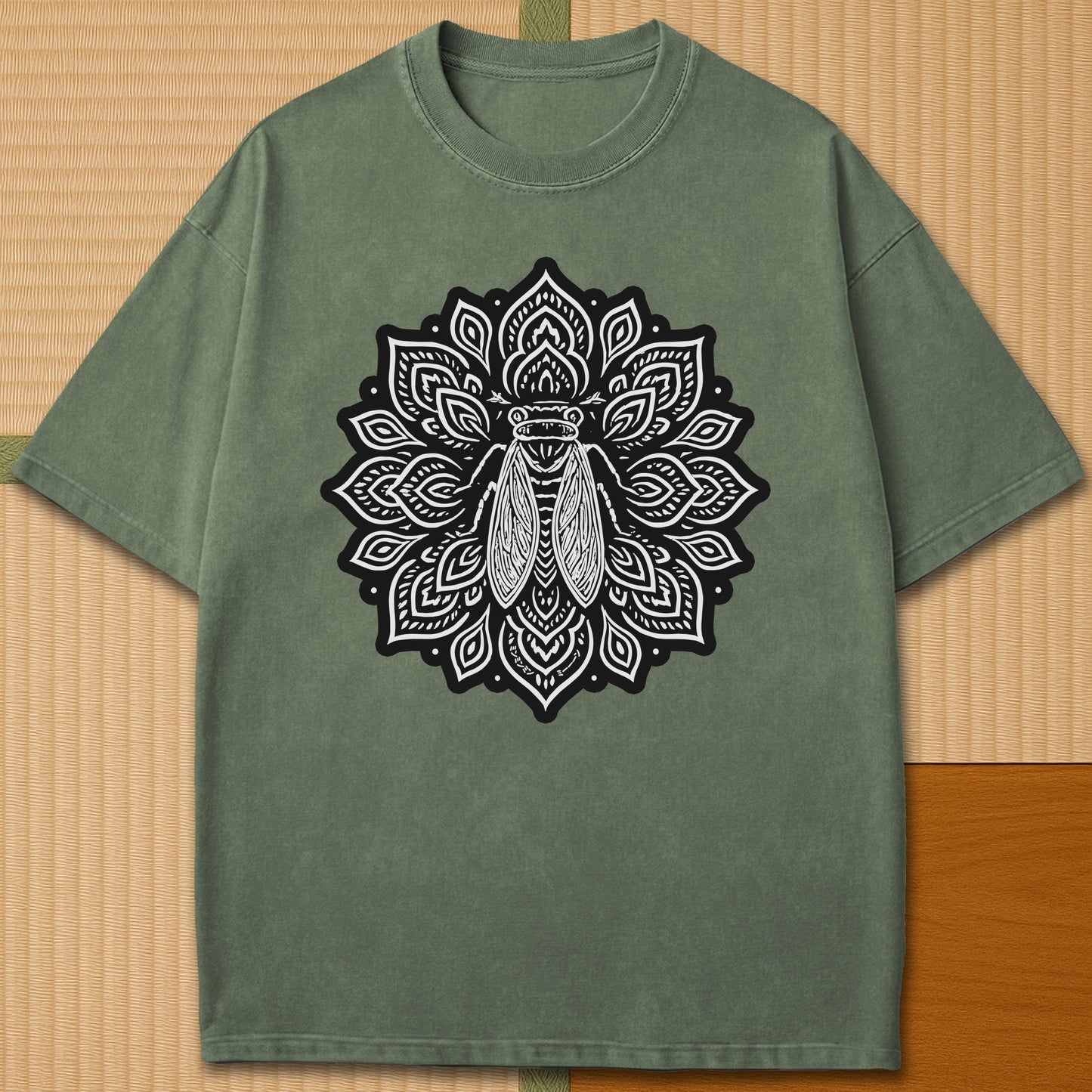 Japanese-inspired cotton Cicada Mandala T-Shirt in Moss on Comfort Colors 1717, styled in a modern flatlay scene.