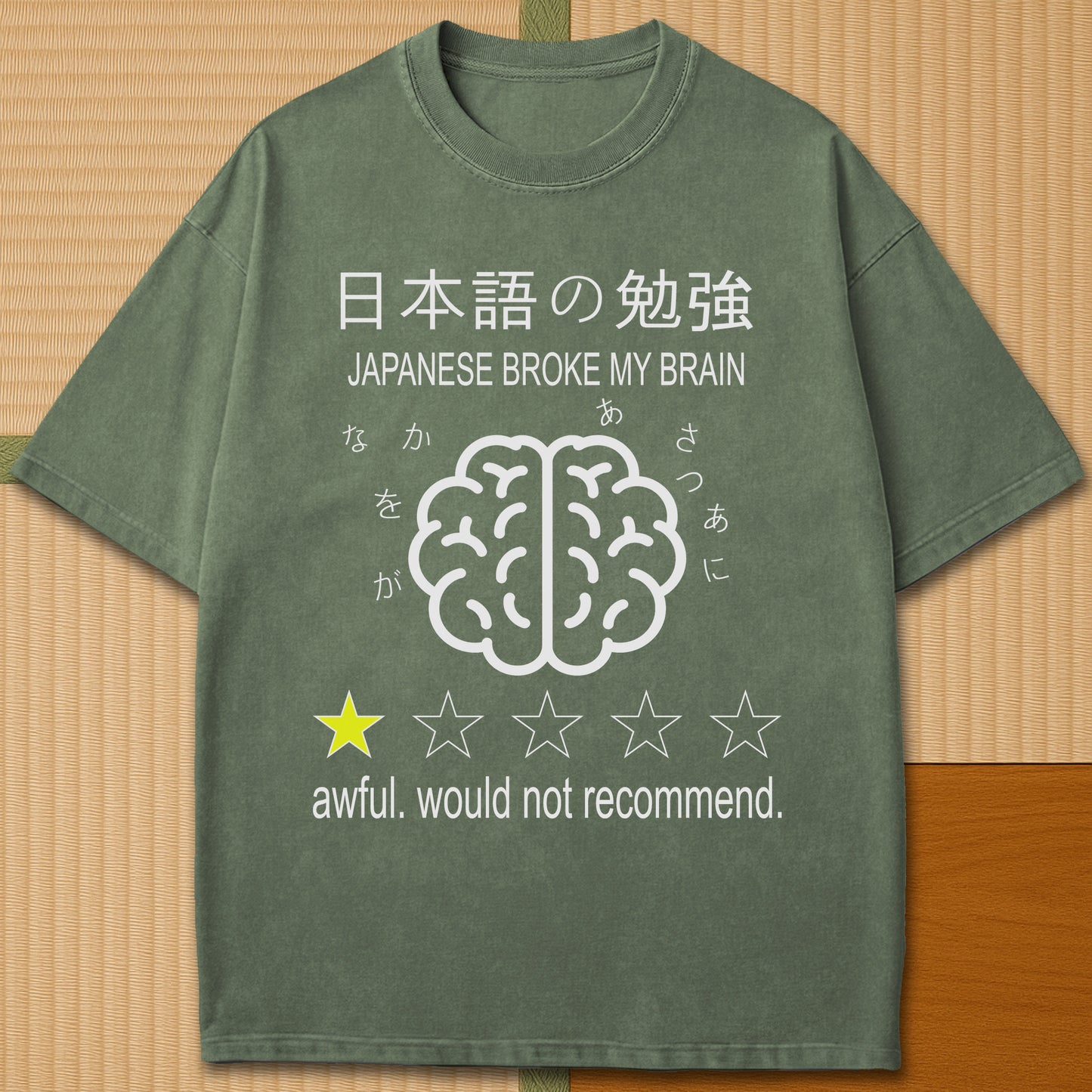 Japanese-inspired cotton Japanese Broke My Brain T-Shirt in Moss on Comfort Colors 1717, styled in a modern flatlay scene.