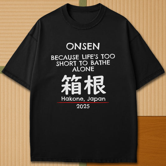 Japanese-inspired cotton Onsen Hakone T-Shirt in Black on Comfort Colors 1717, styled in a modern flatlay scene.