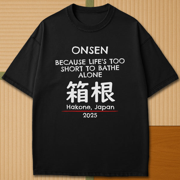 Japanese-inspired cotton Onsen Hakone T-Shirt in Black on Comfort Colors 1717, styled in a modern flatlay scene.