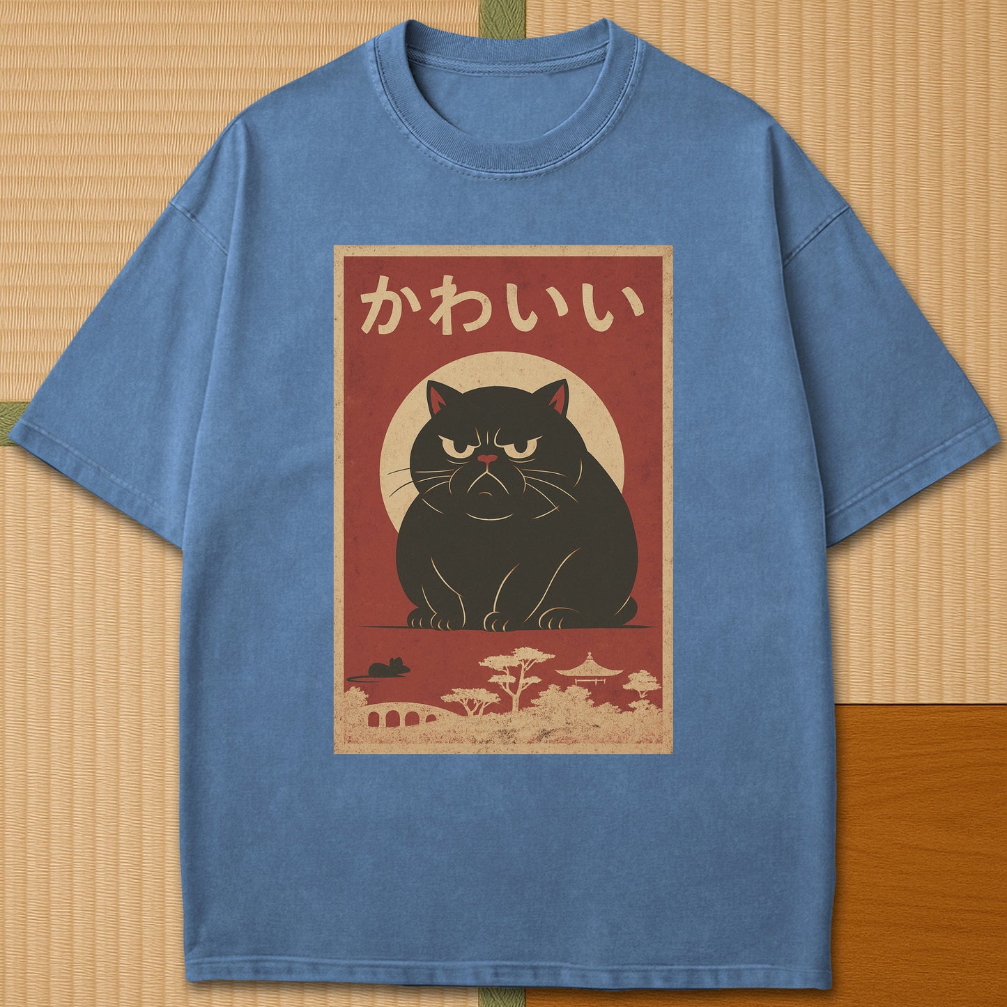 Japanese-inspired cotton Kawaii Rage Cat T-Shirt in Blue Jean on Comfort Colors 1717, styled in a modern flatlay scene.