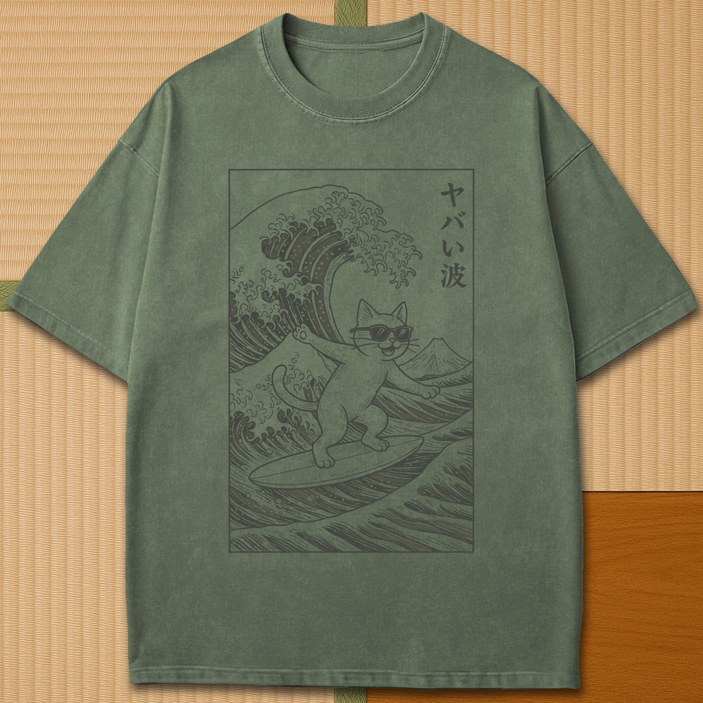 Japanese-inspired cotton Yabai Wave Cat T-Shirt in Moss on Comfort Colors 1717, styled in a modern flatlay scene.