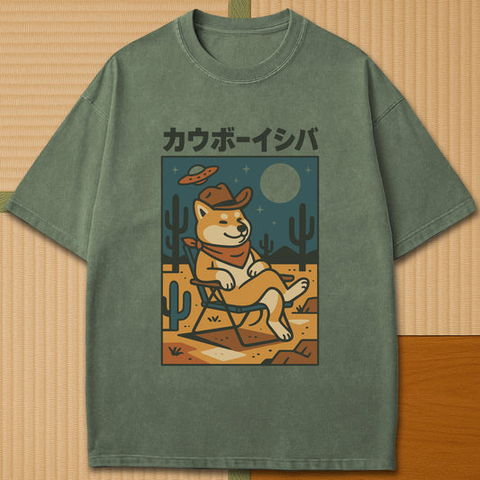 Japanese-inspired cotton Cosmic Cowboy Shiba T-Shirt in Moss on Comfort Colors 1717, styled in a modern flatlay scene.