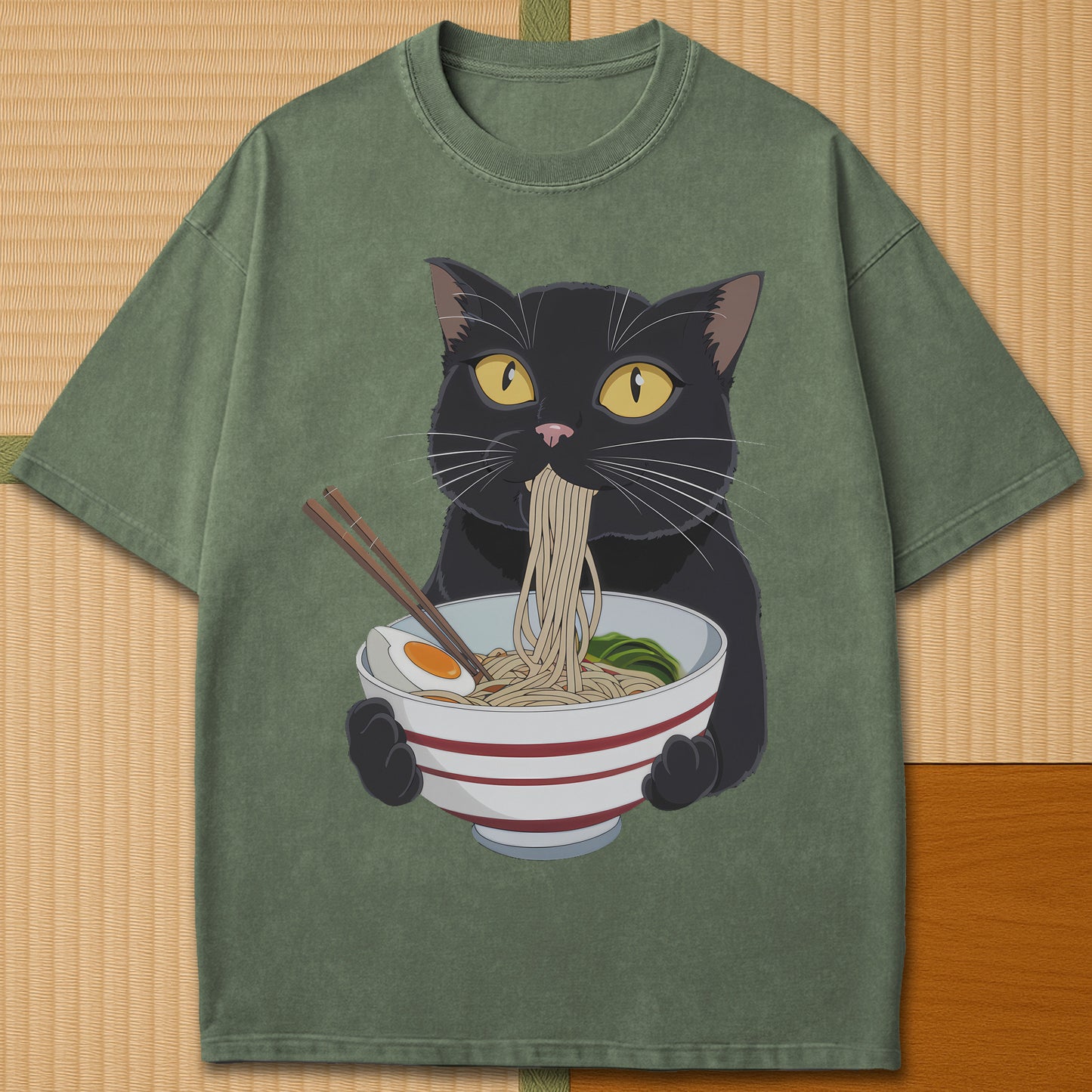Japanese-inspired cotton Cat Eats Ramen T-Shirt in Moss on Comfort Colors 1717, styled in a modern flatlay scene.