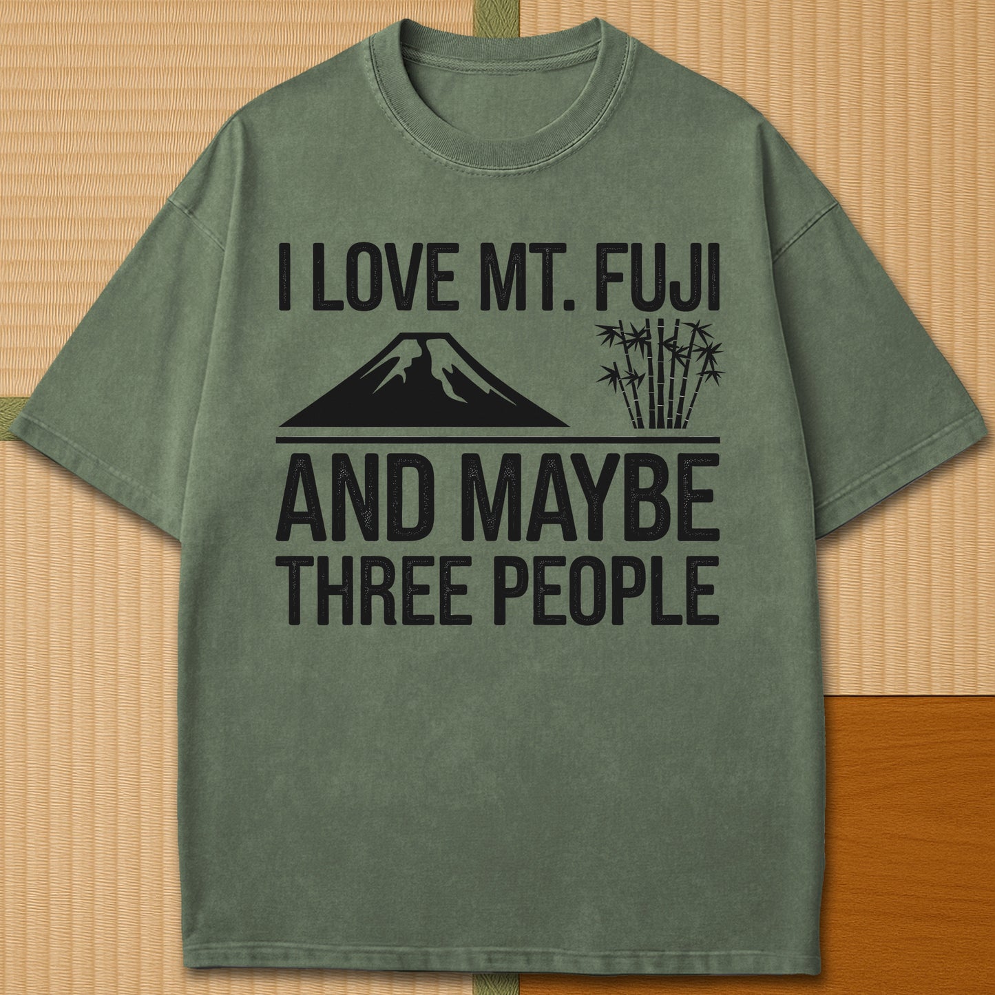 Japanese-inspired cotton I Love Mt Fuji And Maybe Three People T-Shirt in Moss on Comfort Colors 1717, styled in a modern flatlay scene.