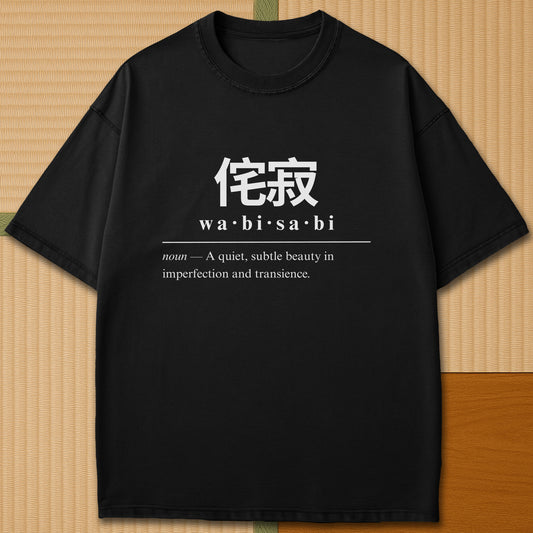 Japanese-inspired cotton Wabisabi Japanese Dictionary T-Shirt in Black on Comfort Colors 1717, styled in a modern flatlay scene.