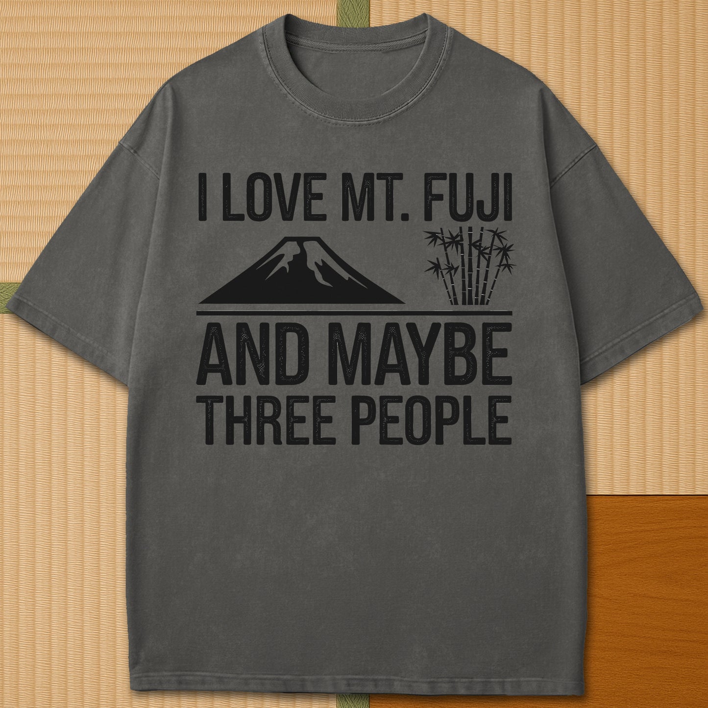 Japanese-inspired cotton I Love Mt Fuji And Maybe Three People T-Shirt in Pepper on Comfort Colors 1717, styled in a modern flatlay scene.