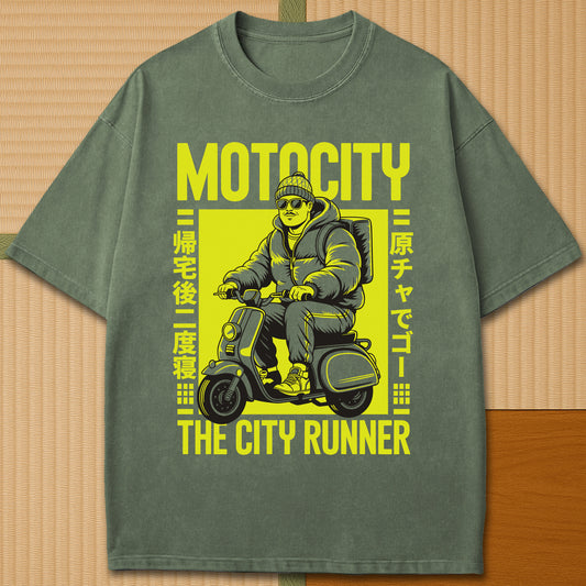 Japanese-inspired cotton Motocity The City Runner T-Shirt in Moss on Comfort Colors 1717, styled in a modern flatlay scene.