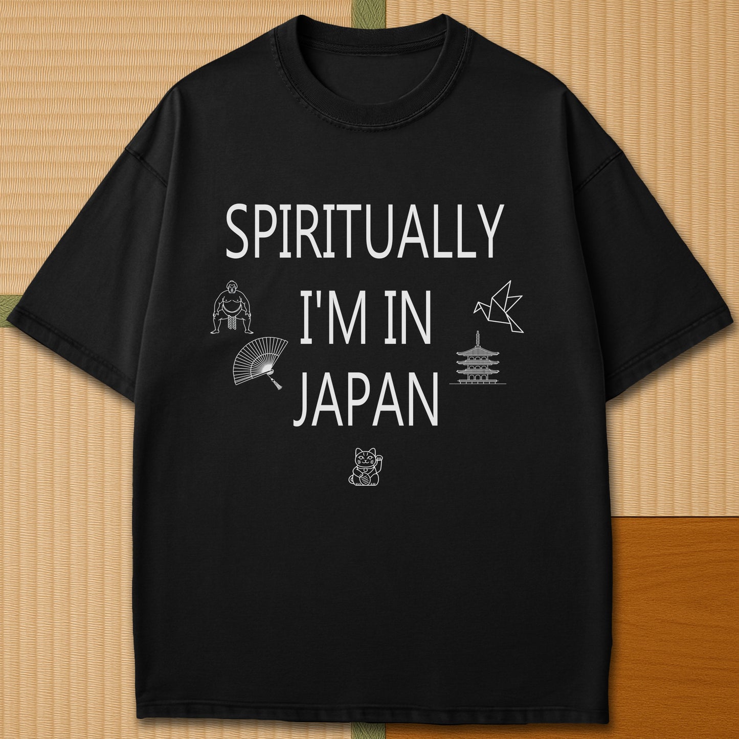 Japanese-inspired cotton Spiritually In Japan T-Shirt in Black on Comfort Colors 1717, styled in a modern flatlay scene.