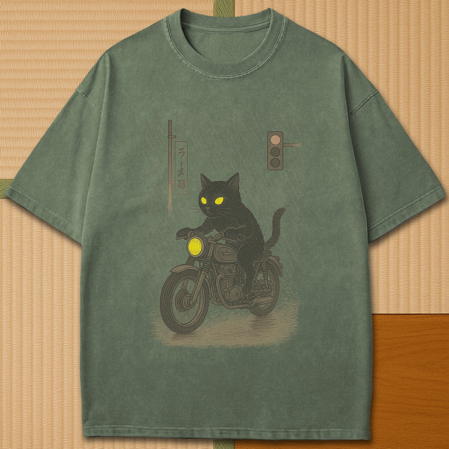 Japanese-inspired cotton Midnight Rain Cat Rider T-Shirt in Moss on Comfort Colors 1717, styled in a modern flatlay scene.