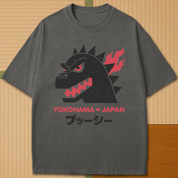 Japanese-inspired cotton Vintage Kaiju Godzilla T-Shirt in Pepper on Comfort Colors 1717, styled in a modern flatlay scene.