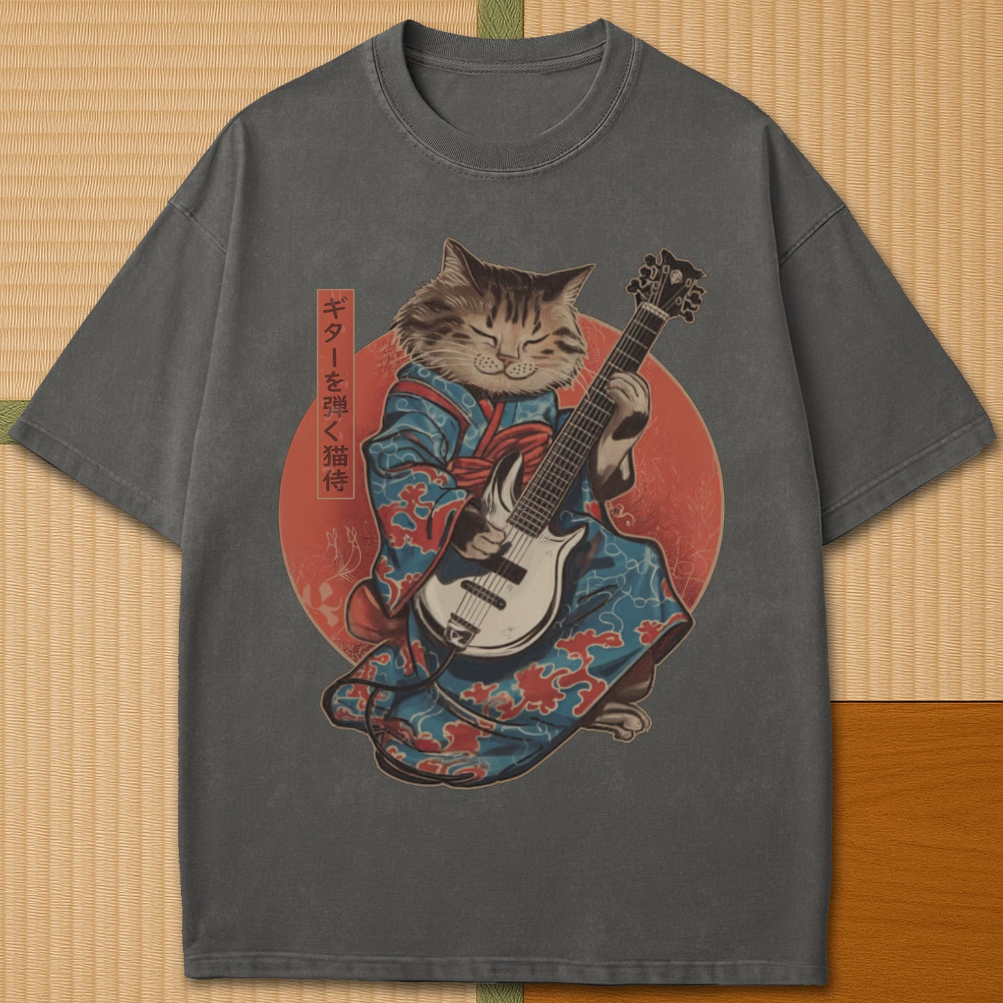 Japanese-inspired cotton Samurai Cat On Guitar T-Shirt in Pepper on Comfort Colors 1717, styled in a modern flatlay scene.