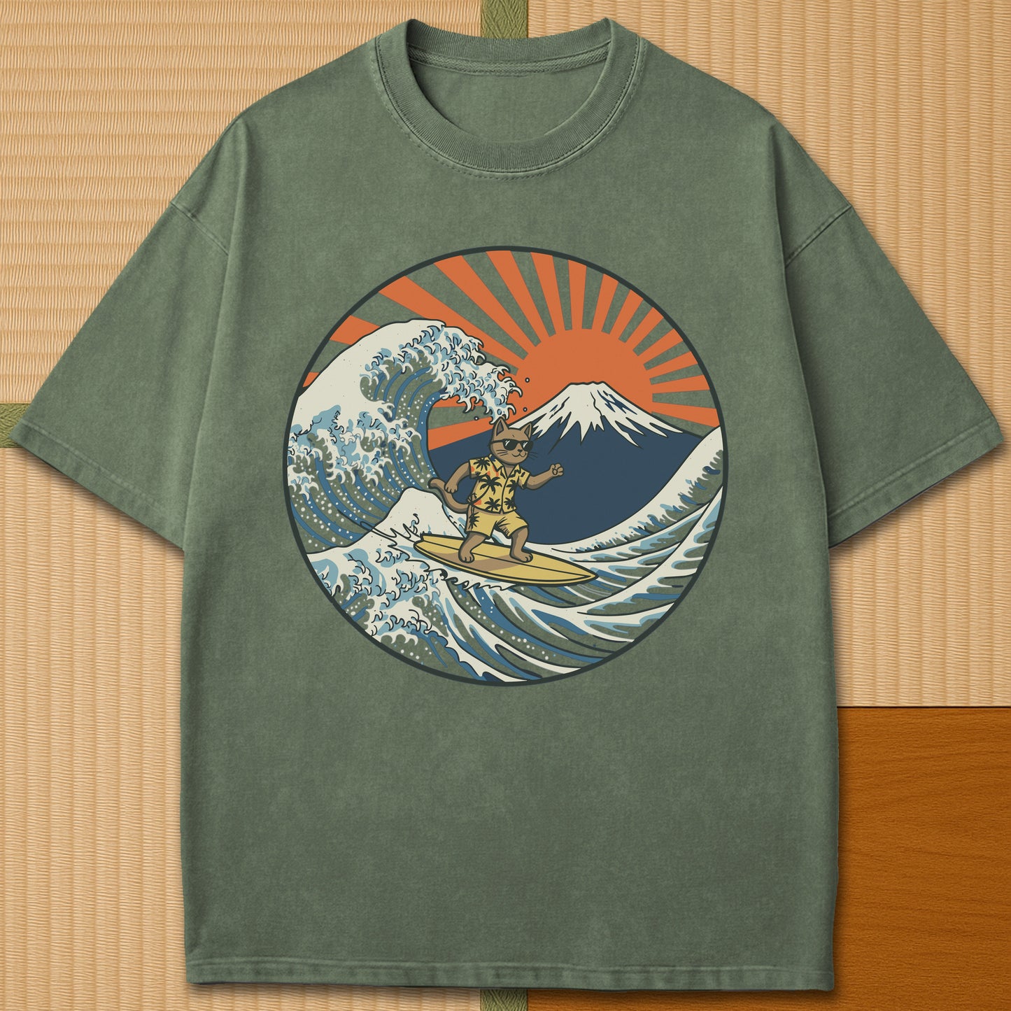 Japanese-inspired cotton Surfing Neko Retro Wave Cat Vs Mt Fuji Sunset T-Shirt in Moss on Comfort Colors 1717, styled in a modern flatlay scene.