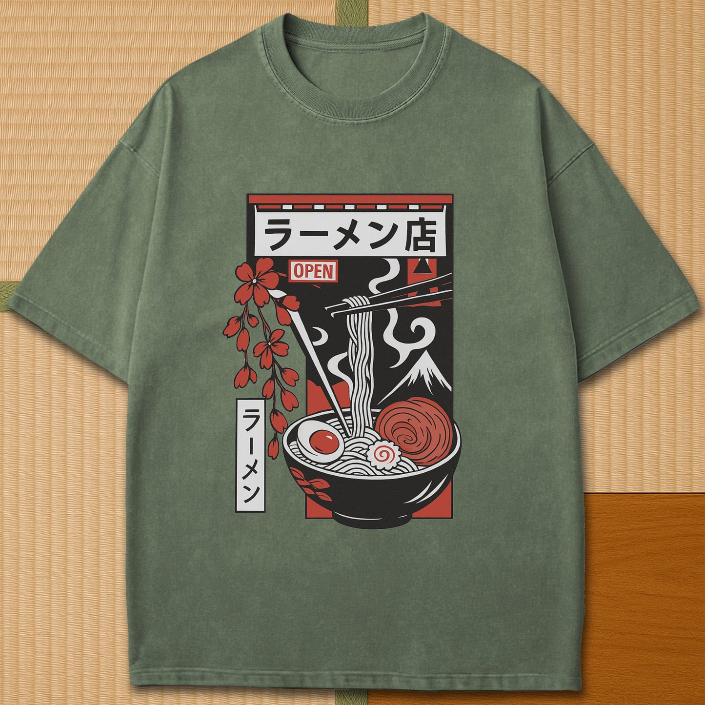 Japanese-inspired cotton Japanese Ramen Bowl T-Shirt in Moss on Comfort Colors 1717, styled in a modern flatlay scene.