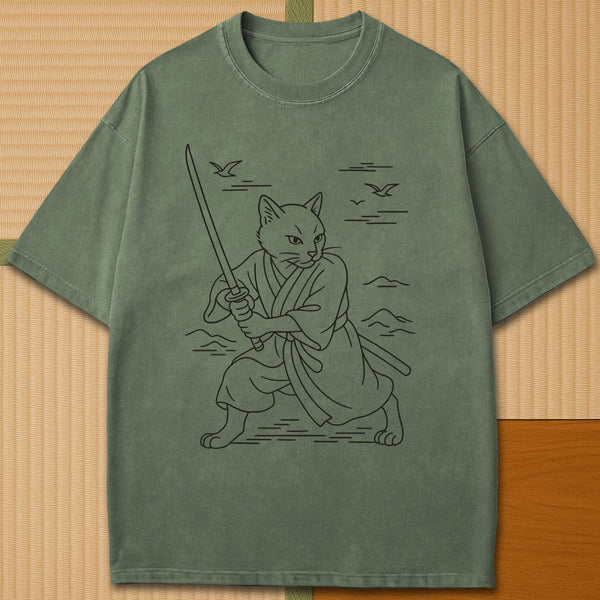 Japanese-inspired cotton Samurai Spirit Cat T-Shirt in Moss on Comfort Colors 1717, styled in a modern flatlay scene.