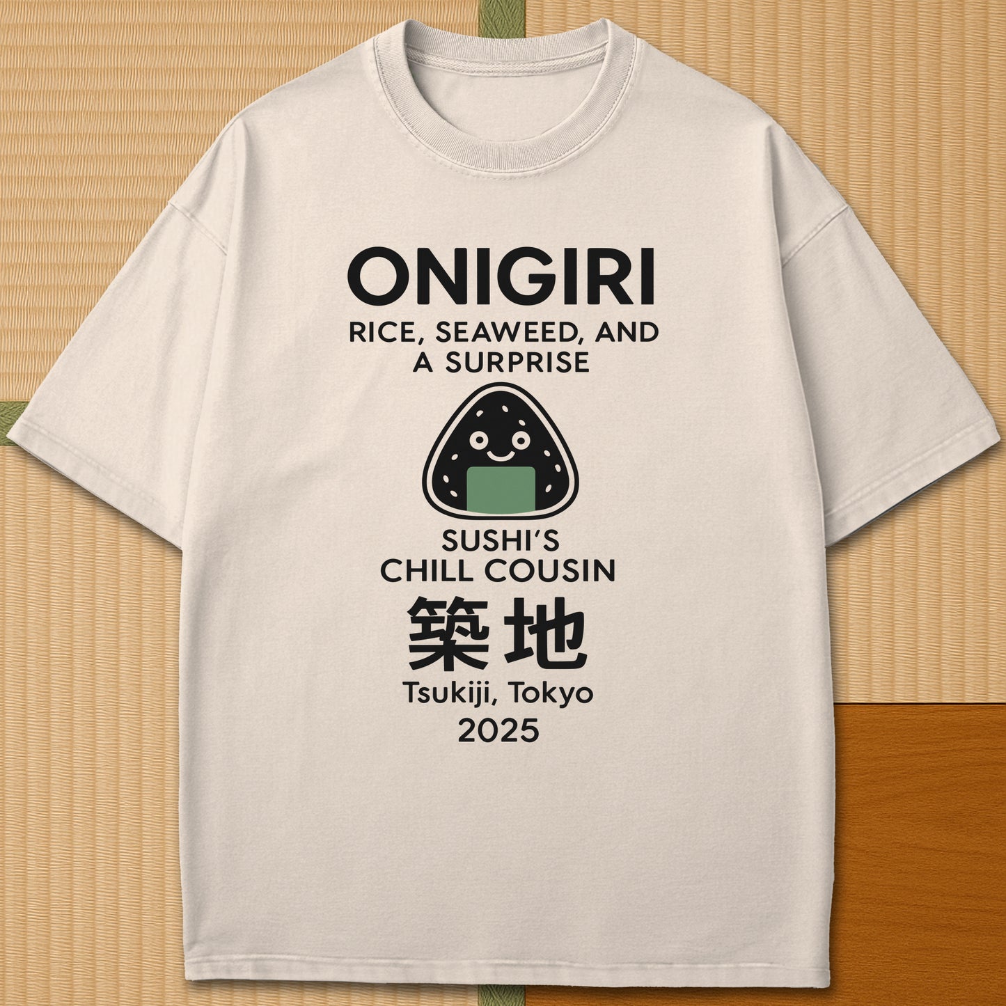 Japanese-inspired cotton Onigiri Chill Cousin Of Sushi T-Shirt in Ivory on Comfort Colors 1717, styled in a modern flatlay scene.