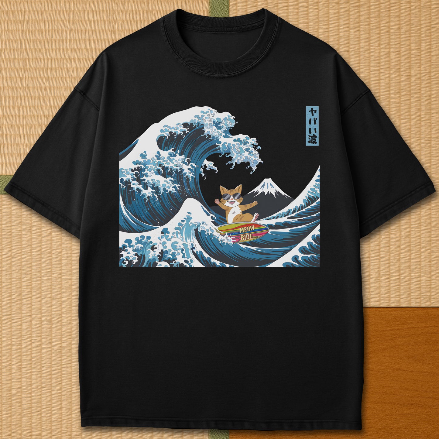 Japanese-inspired cotton Meow Ride T-Shirt in Black on Comfort Colors 1717, styled in a modern flatlay scene.