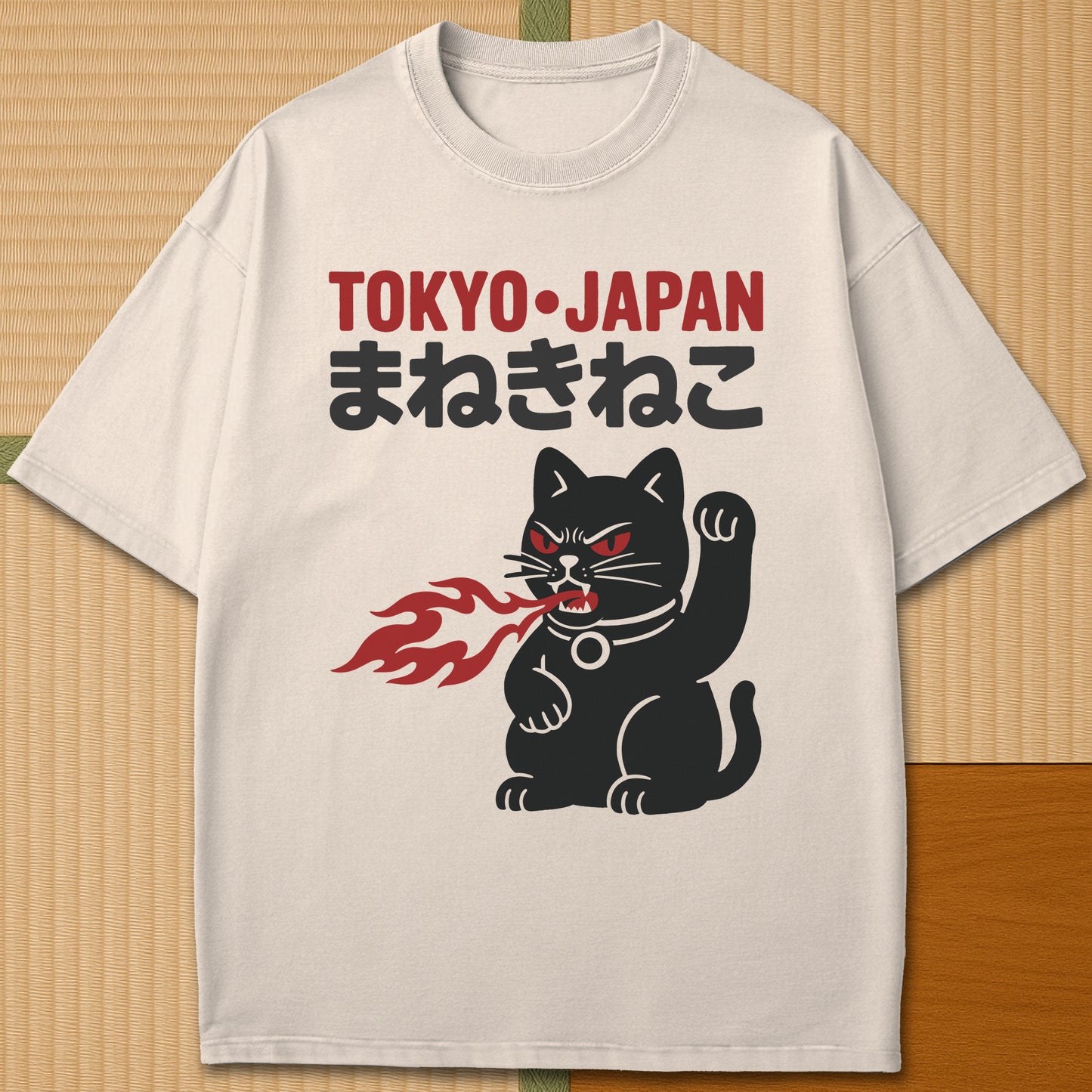 Japanese-inspired cotton Maneki Neko Monster T-Shirt in Ivory on Comfort Colors 1717, styled in a modern flatlay scene.