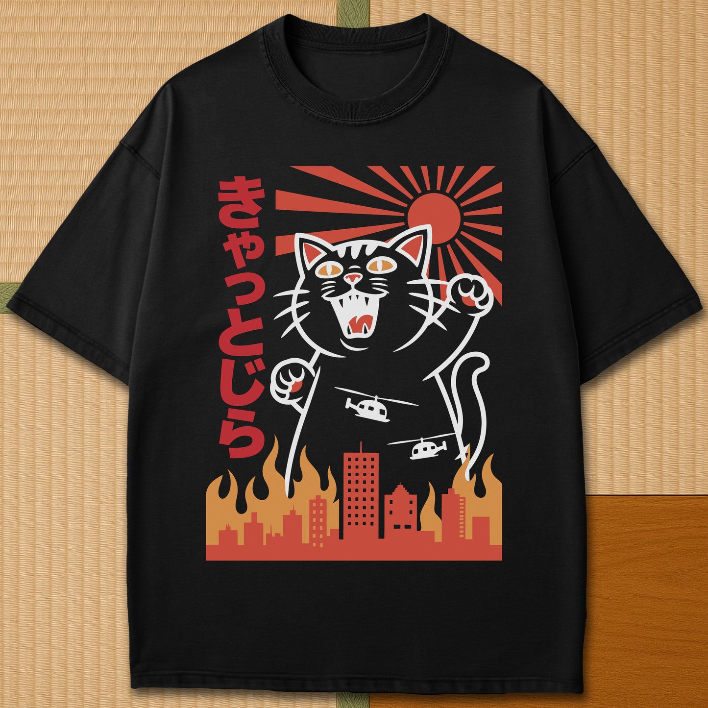 Japanese-inspired cotton Catzilla Rising Sun T-Shirt in Black on Comfort Colors 1717, styled in a modern flatlay scene.