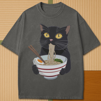 Japanese-inspired cotton Cat Eats Ramen T-Shirt in Pepper on Comfort Colors 1717, styled in a modern flatlay scene.