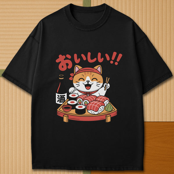 Japanese-inspired cotton Cute Cat And Sushi T-Shirt in Black on Comfort Colors 1717, styled in a modern flatlay scene.