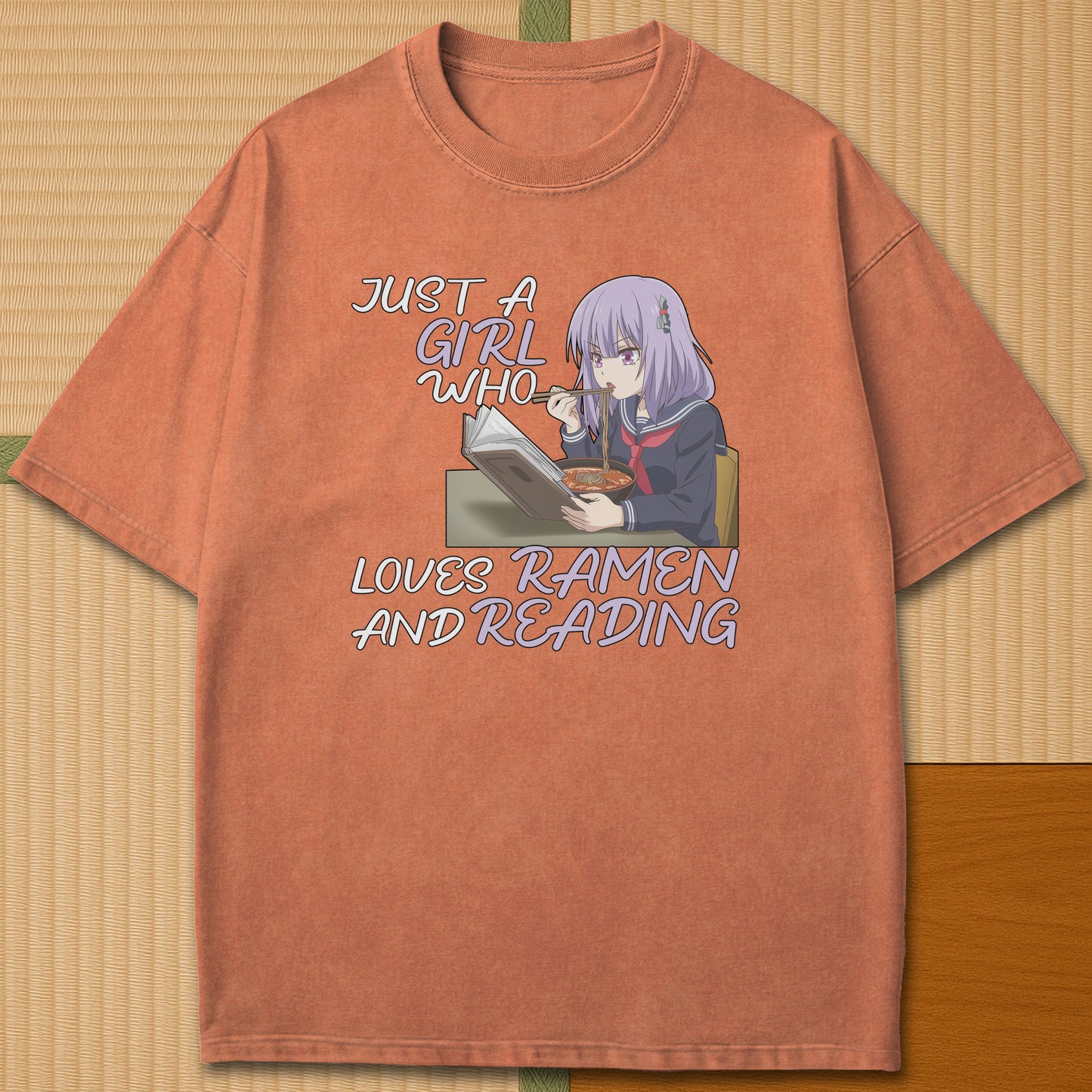 Japanese-inspired cotton Ramen And Reading T-Shirt in Yam on Comfort Colors 1717, styled in a modern flatlay scene.