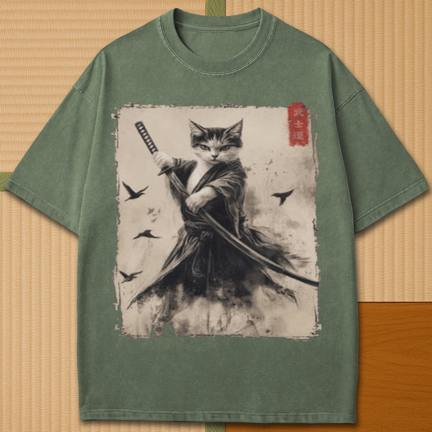 Japanese-inspired cotton Cat Samurai T-Shirt in Moss on Comfort Colors 1717, styled in a modern flatlay scene.