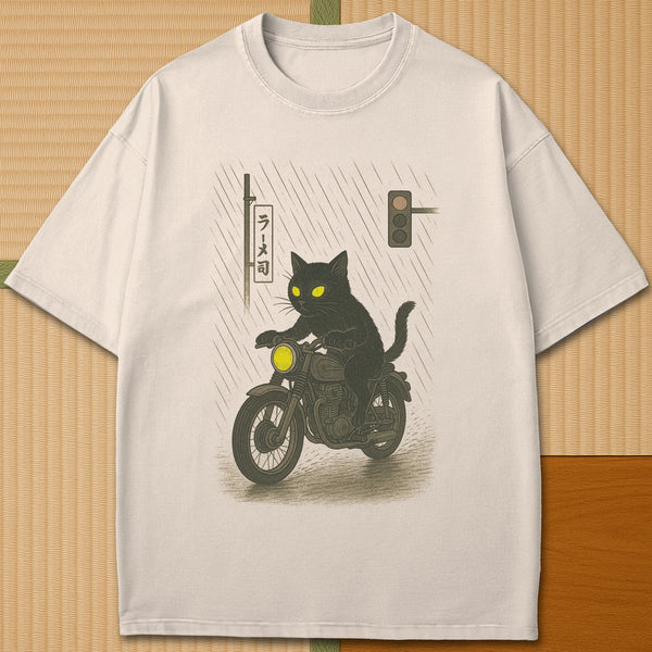 Japanese-inspired cotton Midnight Rain Cat Rider T-Shirt in Ivory on Comfort Colors 1717, styled in a modern flatlay scene.