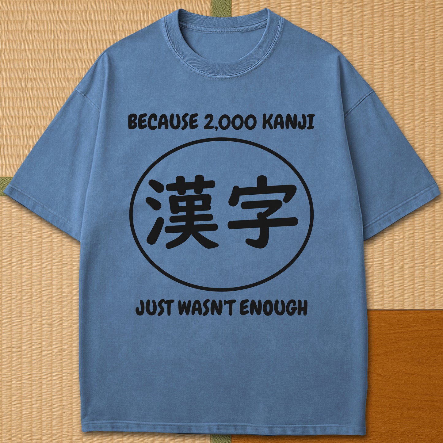 Japanese-inspired cotton Never Enough Kanji T-Shirt in Blue Jean on Comfort Colors 1717, styled in a modern flatlay scene.