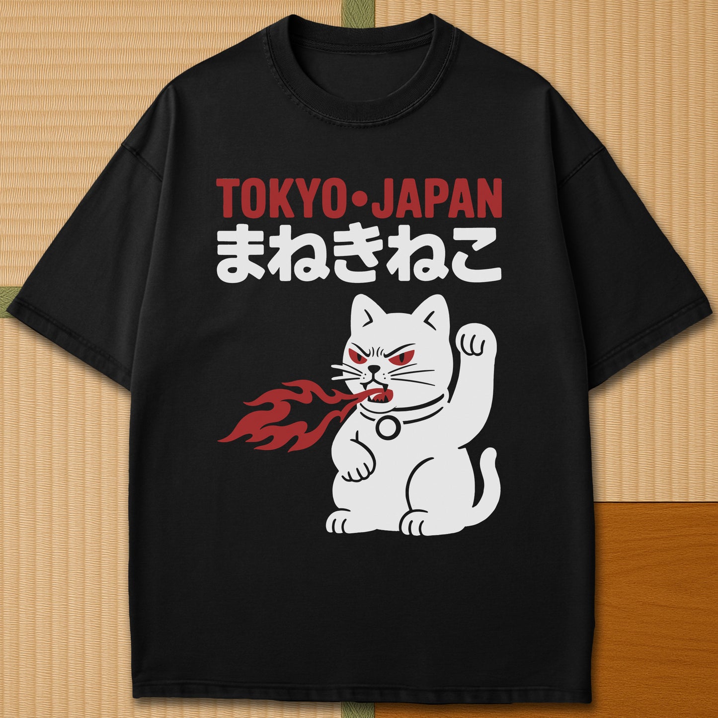 Japanese-inspired cotton Maneki Neko Monster T-Shirt in Black on Comfort Colors 1717, styled in a modern flatlay scene.