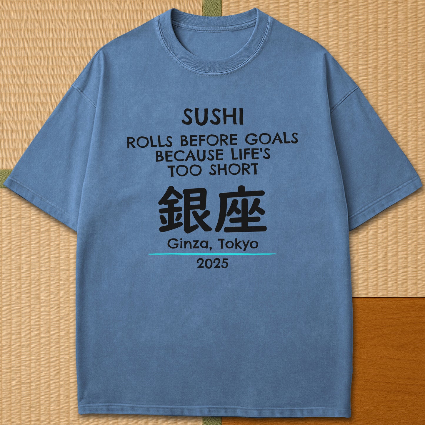 Japanese-inspired cotton Sushi Rolls Before Goals T-Shirt in Blue Jean on Comfort Colors 1717, styled in a modern flatlay scene.