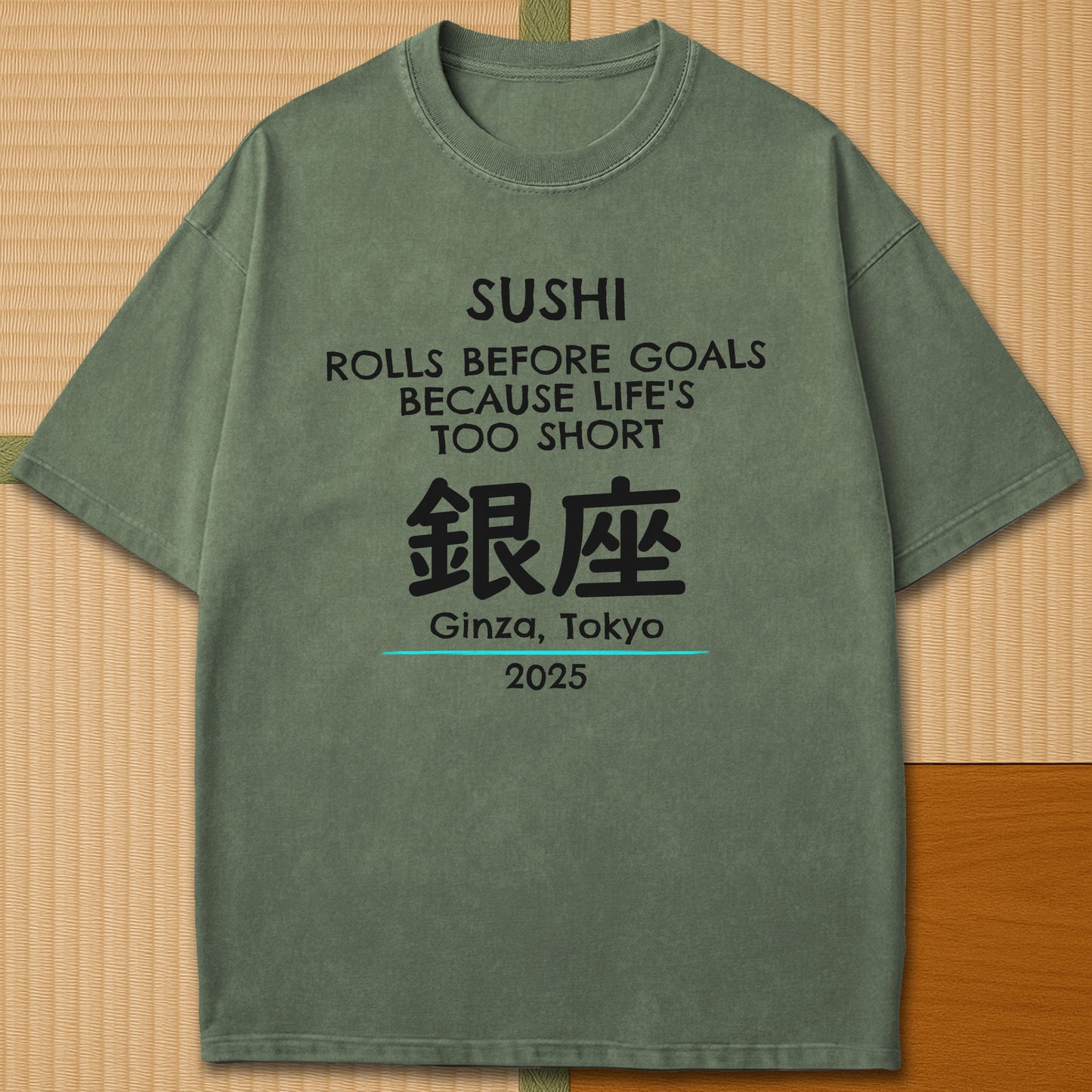 Japanese-inspired cotton Sushi Rolls Before Goals T-Shirt in Moss on Comfort Colors 1717, styled in a modern flatlay scene.