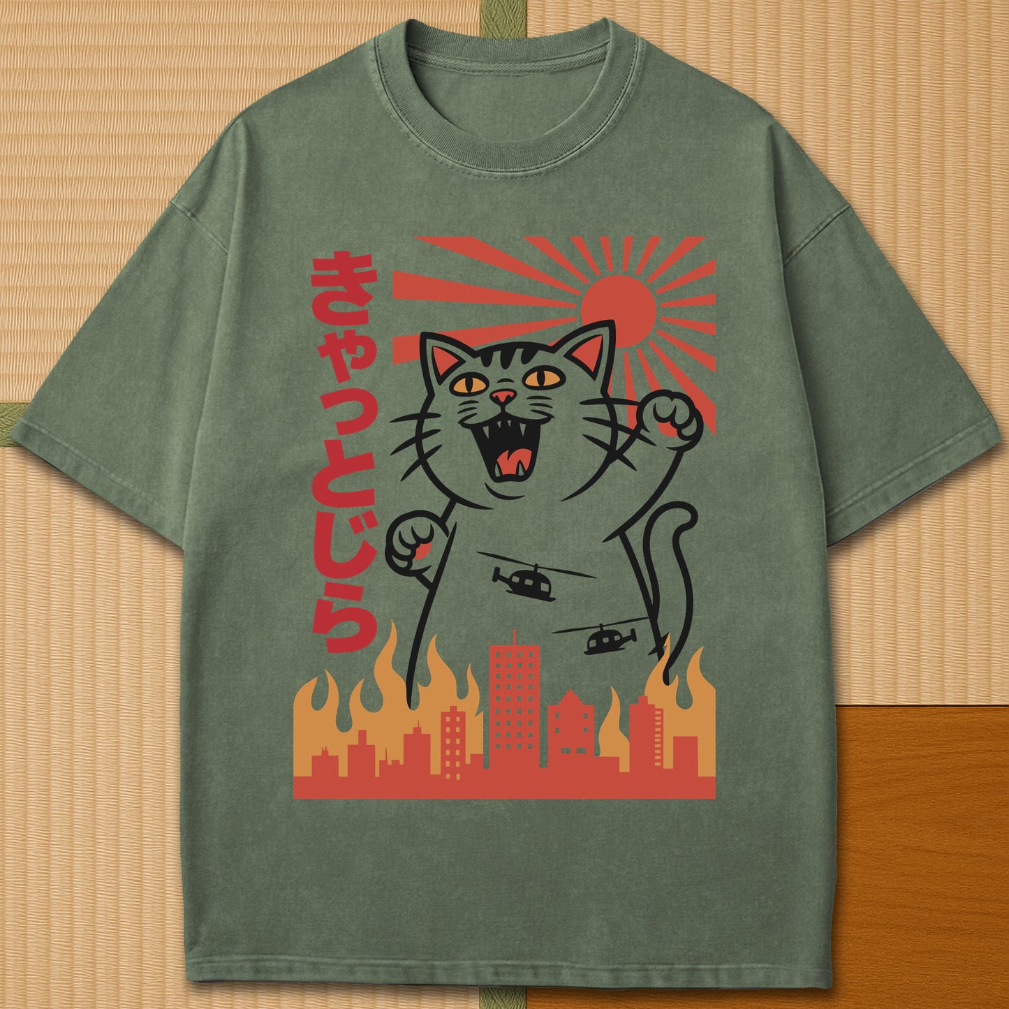 Japanese-inspired cotton Catzilla Rising Sun T-Shirt in Moss on Comfort Colors 1717, styled in a modern flatlay scene.