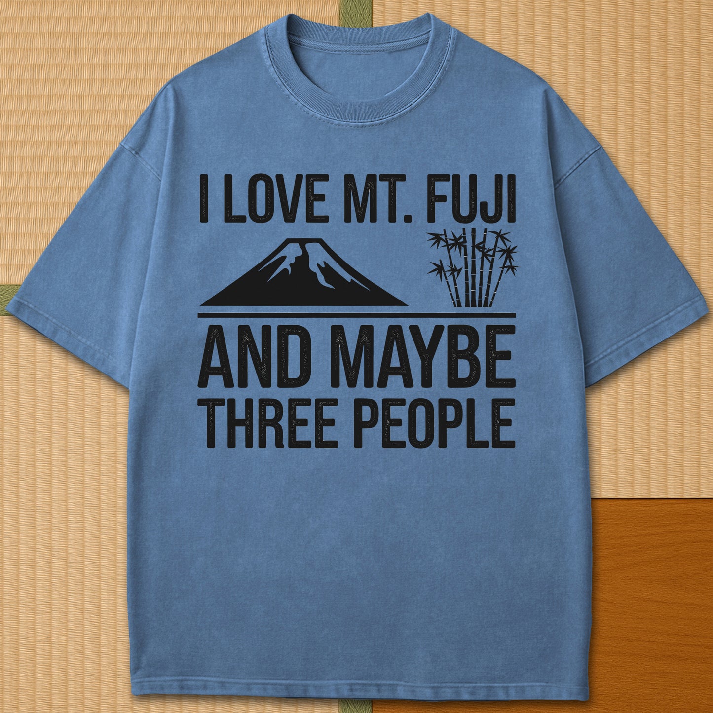 Japanese-inspired cotton I Love Mt Fuji And Maybe Three People T-Shirt in Blue Jean on Comfort Colors 1717, styled in a modern flatlay scene.