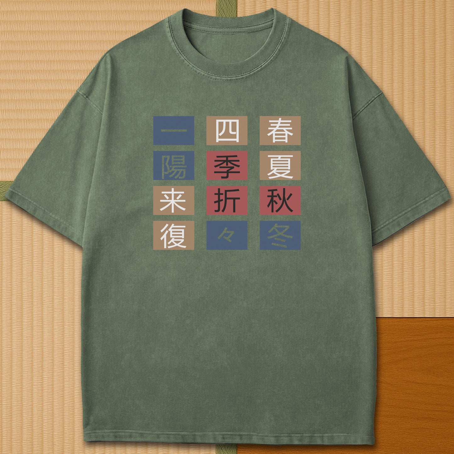 Japanese-inspired cotton The Seasons T-Shirt in Moss on Comfort Colors 1717, styled in a modern flatlay scene.