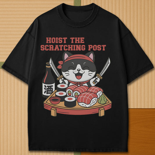 Japanese-inspired cotton Sushi Pirate Hoist The Scratching Post T-Shirt in Black on Comfort Colors 1717, styled in a modern flatlay scene.