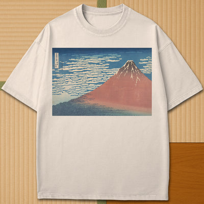 Japanese-inspired cotton Red Fuji By Hokusai T-Shirt in Ivory on Comfort Colors 1717, styled in a modern flatlay scene.