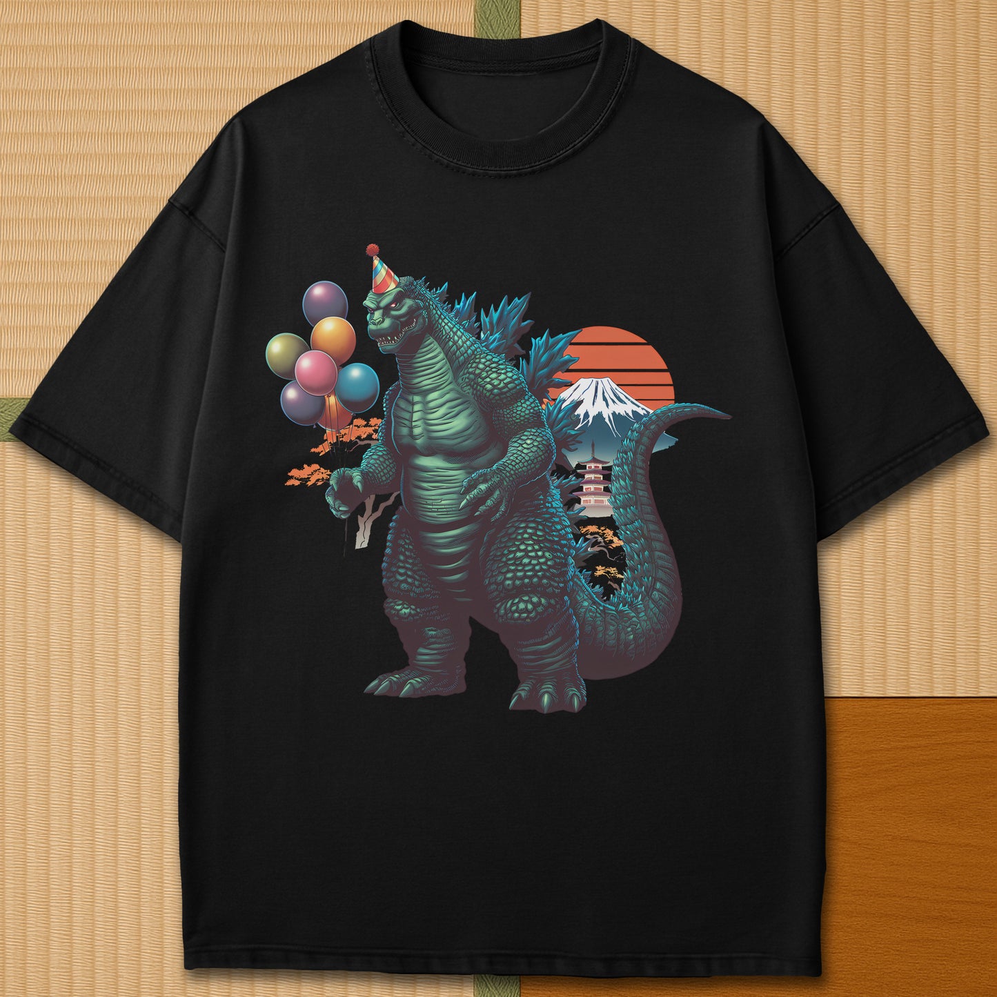 Japanese-inspired cotton Birthday Kaiju T-Shirt in Black on Comfort Colors 1717, styled in a modern flatlay scene.