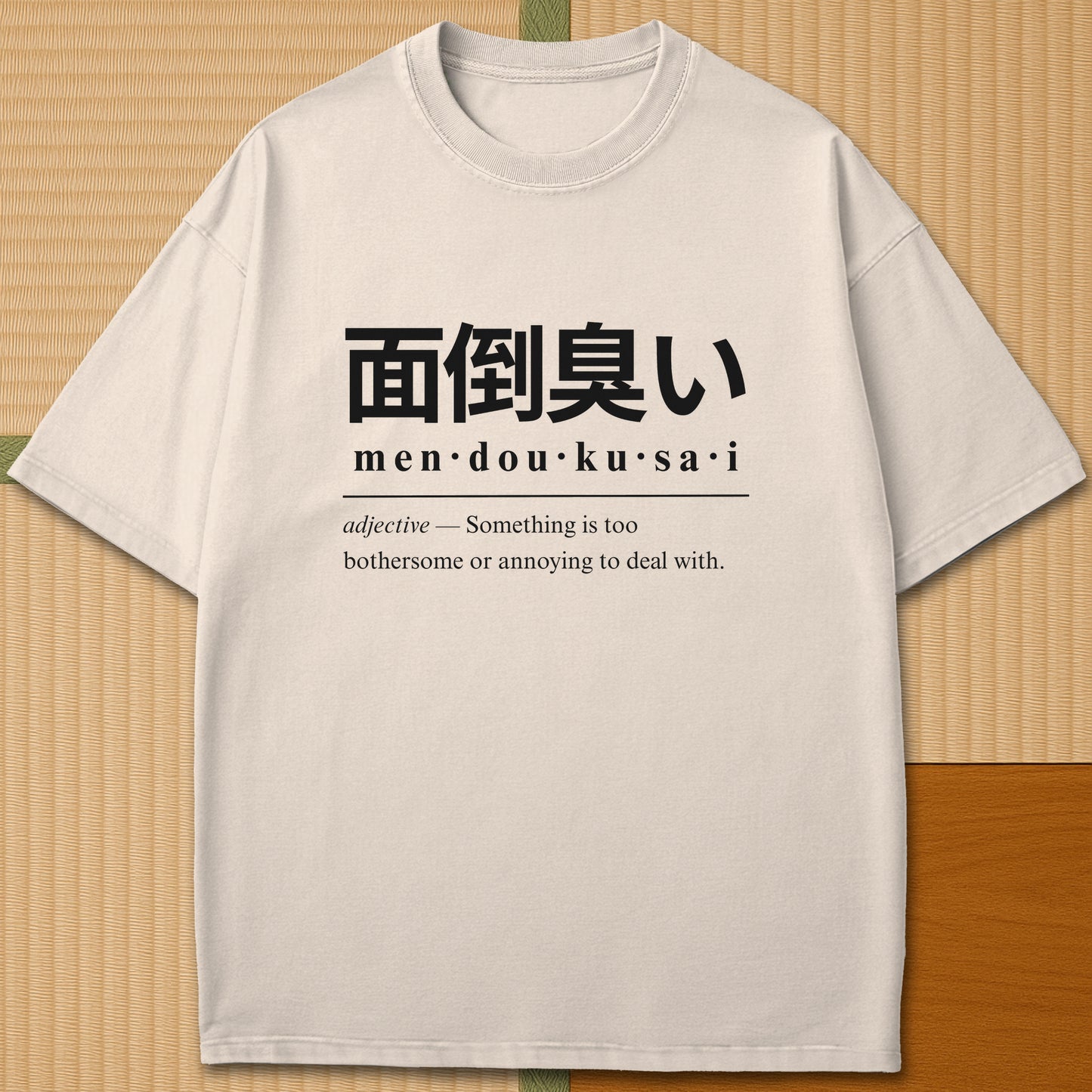 Japanese-inspired cotton Mendoukusai Japanese Dictionary T-Shirt in Ivory on Comfort Colors 1717, styled in a modern flatlay scene.