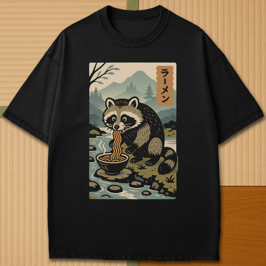 Japanese-inspired cotton Tanuki Slurping Ramen T-Shirt in Black on Comfort Colors 1717, styled in a modern flatlay scene.