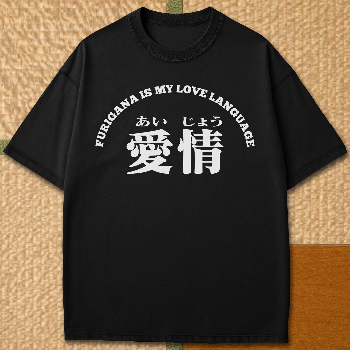 Japanese-inspired cotton Furigana Love Language T-Shirt in Black on Comfort Colors 1717, styled in a modern flatlay scene.