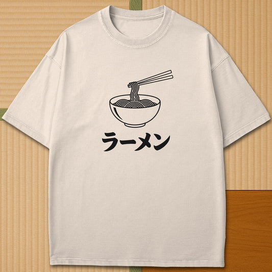 Japanese-inspired cotton Ramen Noodle Minimalist T-Shirt in Ivory on Comfort Colors 1717, styled in a modern flatlay scene.